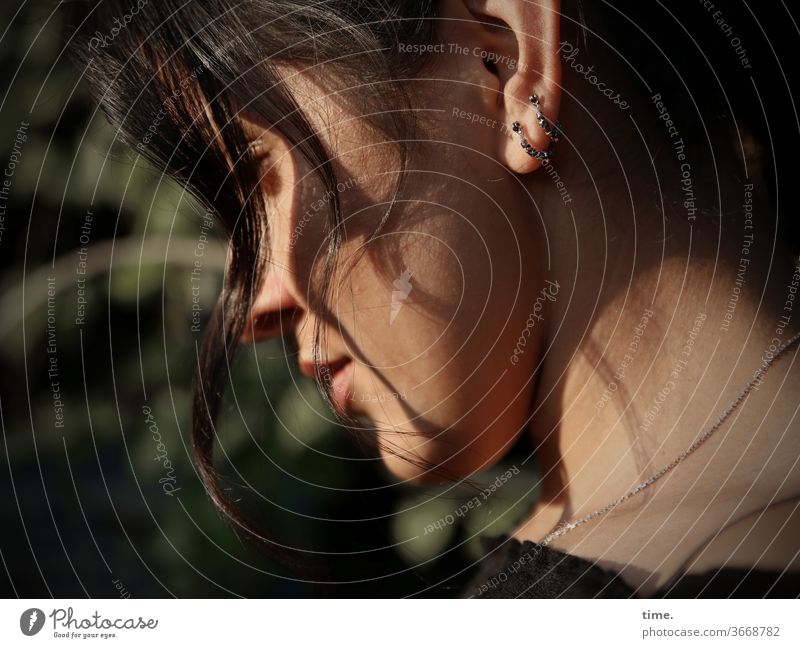 Estila Profile sunny evening light hairstyle lost in thought Woman feminine Earring Jewellery hollowed Moody melancholy Concentrate Shadow highlights warm