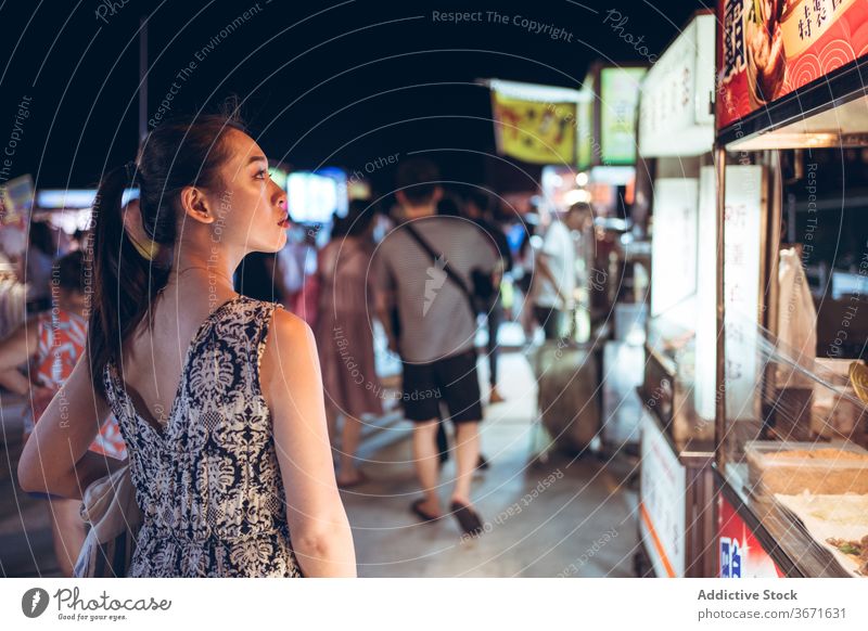 Asian woman in Zhubei Night Market night market female counter evening summer stall food street food crowd zhubei taiwan asian ethnic city town stand urban