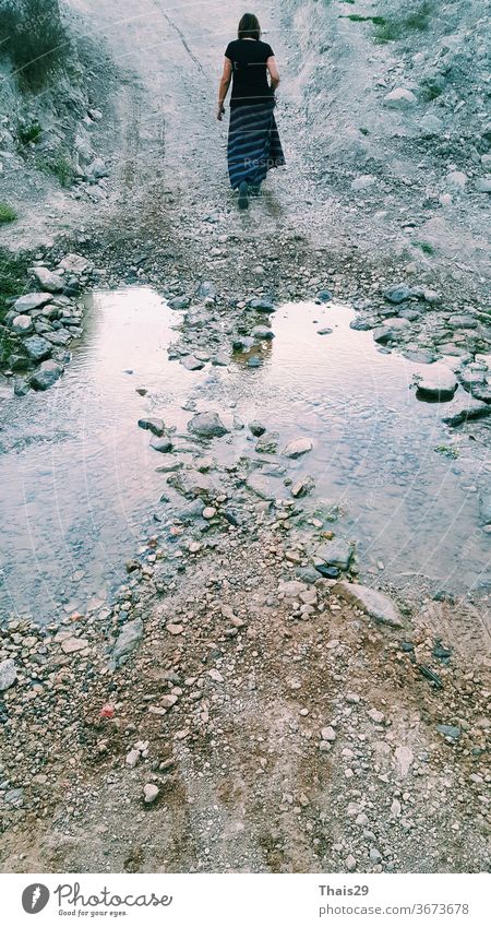 woman female walking on the road near the river silhouette silence hiking freedom travel alone young girl outdoor lifestyle nature person water beautiful