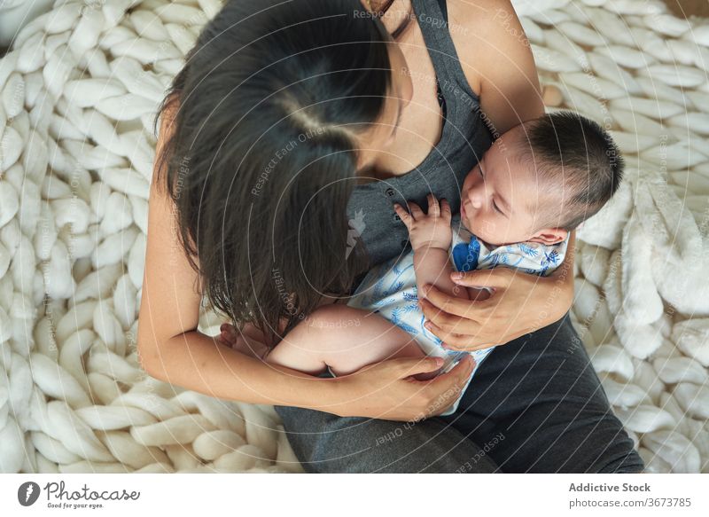 Baby holding his mother's hand family baby child boy fun enjoy home at home stay at home beautiful model portrait flat people happy family caucasian chinese