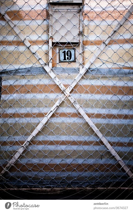 Sweet little 19 door Fence Wire netting fence too Closed number House number digit Lettering writing typography Stripe Screening Goal garden door Garden door