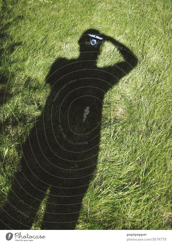 Shadow self-portrait Shadow play Dark side Self portrait Shadowy existence Silhouette Human being Exterior shot Contrast Man Take a photo Meadow Lawn camera