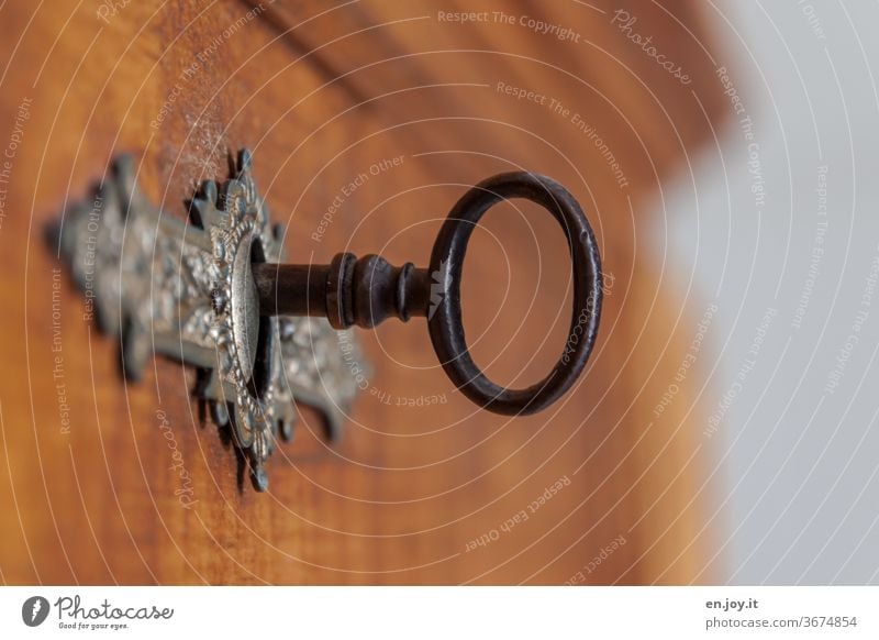 Key on a chest of drawers Chest of drawers Cupboard Lock Old Ancient Furniture antique furniture Metal Iron Blur Close-up Mysterious already Closed wood Safety