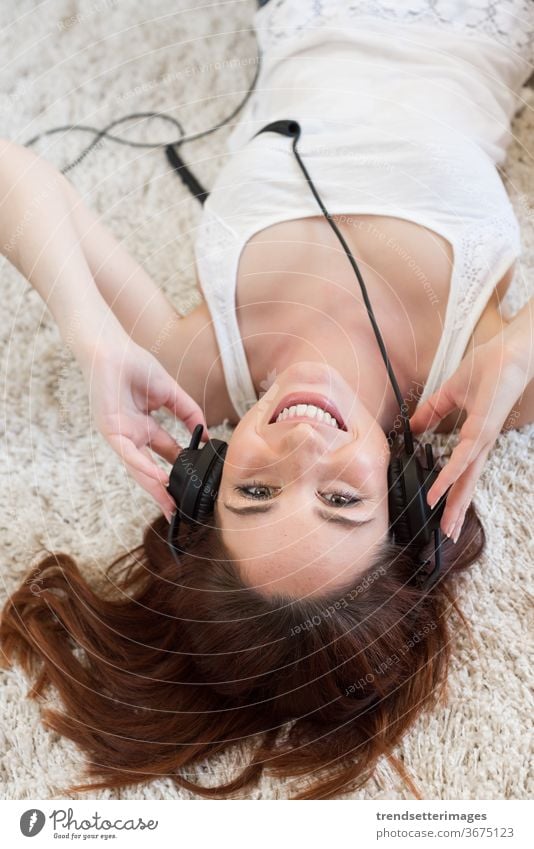 Woman with headphones woman music girl listening young beautiful background white people female pretty attractive happy portrait adult caucasian isolated smile