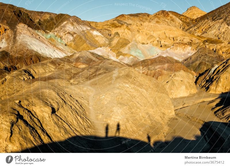 Scenic view on the Artist drive in the Death Valley with shadows of visitors on the rocks national park usa valley death valley artist drive artist's road