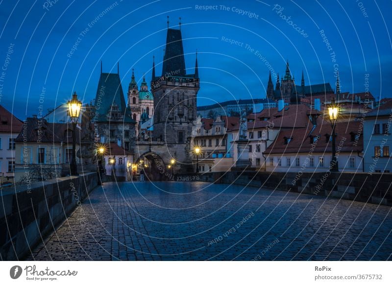 Early morning on the Charles Bridge in Prague. river city architecture bridge europe travel water castle cityscape czech town Vltava sky old swan view church