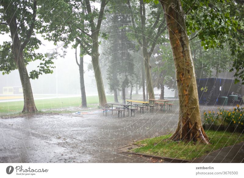 rain Rain Weather showers summer rain Beer garden Empty Deserted Bench Table Furniture Outdoor furniture Folding table folding bench Places tree Puddle rainy