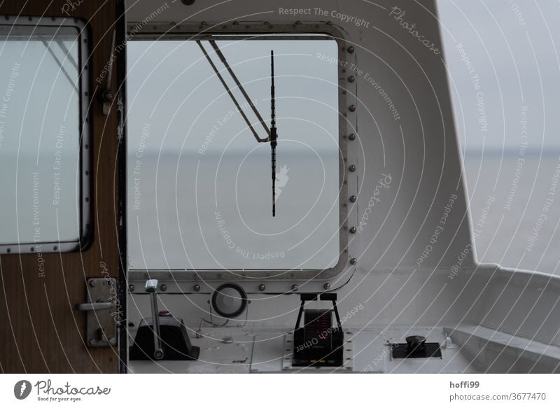 View through the windscreen of a ferry on the North Sea Navigation Ferry poor visibility driver's cab Captain Fog Autumn Winter Bridge Windscreen wiper