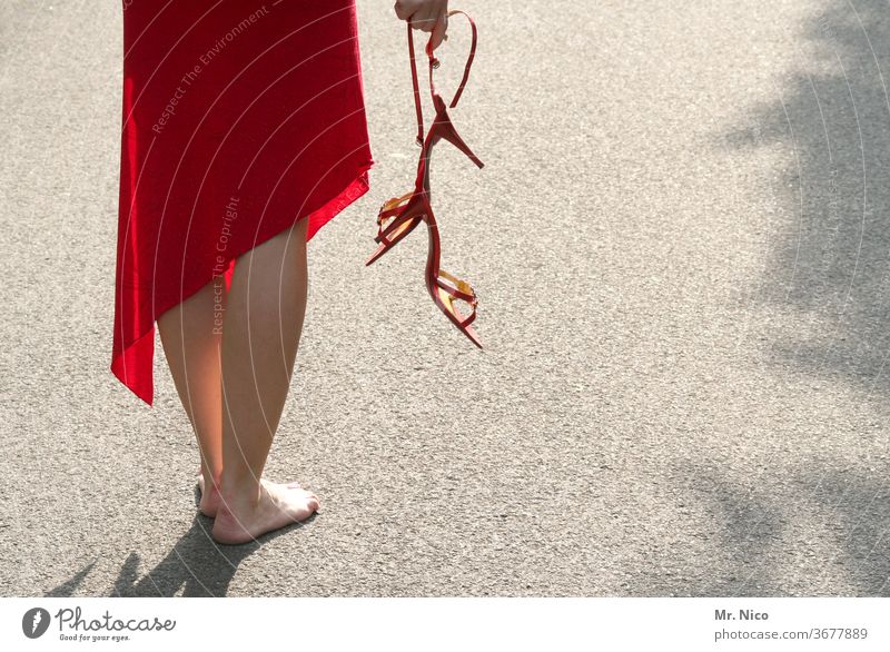 red shoes, red dress Dress Footwear take off one's shoes Barefoot Summer dress Woman Legs feet Skin Red Stand High heels Calf Asphalt high-heeled shoe