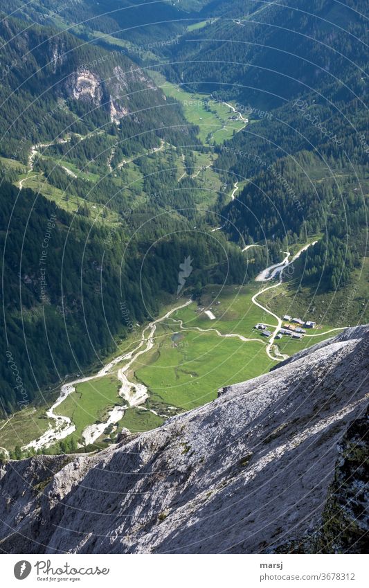 With a view of the Ursprungalm look down Narrow mountain road Austria Preunegg Alpine pasture Valley wooded Alps silent tranquillity Mountain Vacation & Travel