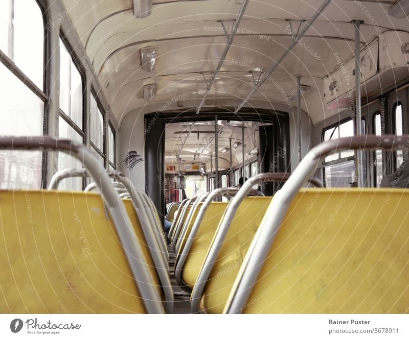 Interior of an old tram in Belgrade, Serbia belgrade inside interior metal public retro train transport transportation vintage weathered seat train seat