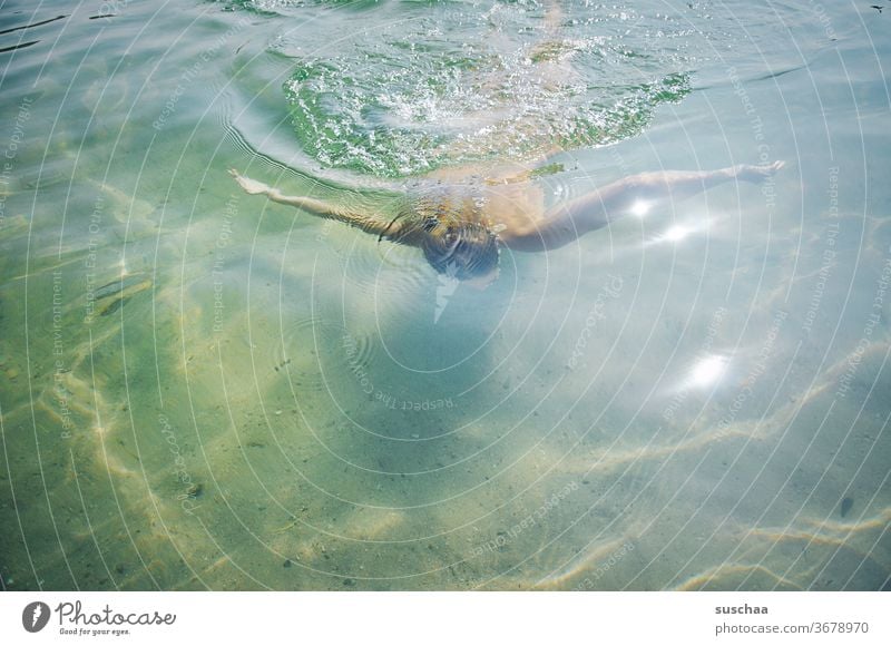 girl swims in shallow sea water Human being Child Youth (Young adults) Lake Water seawater Dive be afloat bathe Swimming & Bathing Summer vacation