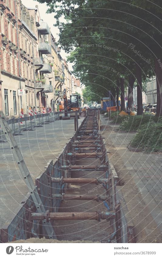 municipal construction site Construction site Town Karlsruhe Street torn open road Pipe laying urban built Old building huts Ladder Iron mounting