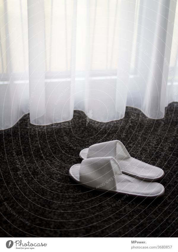 limp for the hotel Footwear Slipper Hotel Hotel room Wellness Window Carpet Drape Bedroom Deserted Loneliness Vacation & Travel Living or residing