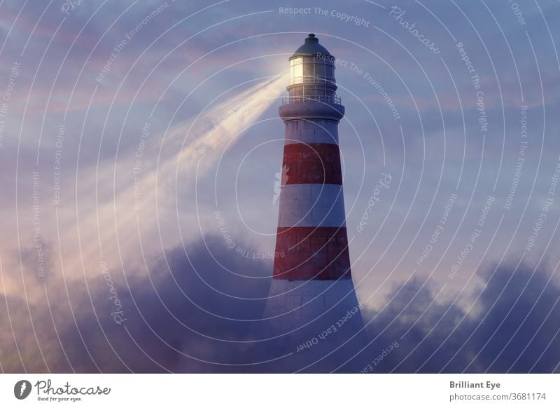 illuminated lighthouse above fluffy clouds Nautical Navigation Vintage colourful Picturesque light tower Construction bank Outdoors Classic coastline Coast