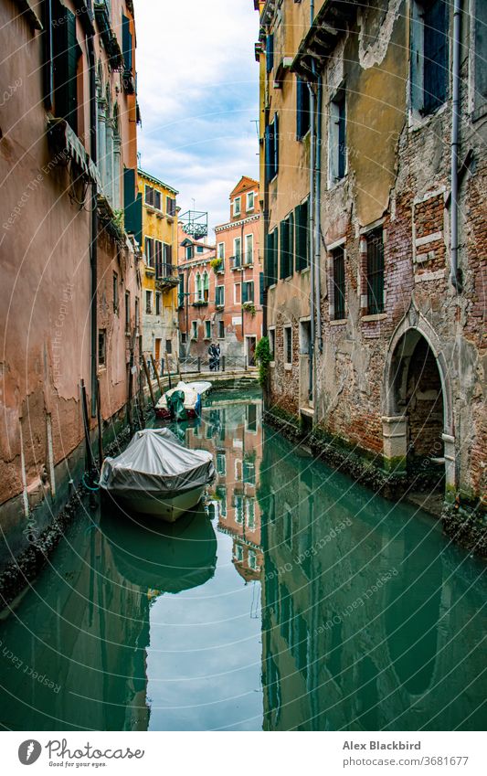 Boat on a Venice canal boat calm carnival channel city cityscape color image downtown district european gondola grand idyllic italia italian italy lagoon