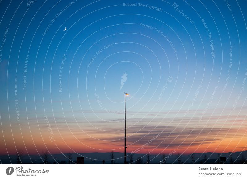 Evening atmosphere: crescent moon over floodlight and sunset red evening mood Twilight Crescent moon Floodlight Moody Sky Dusk Landscape Silhouette Deserted