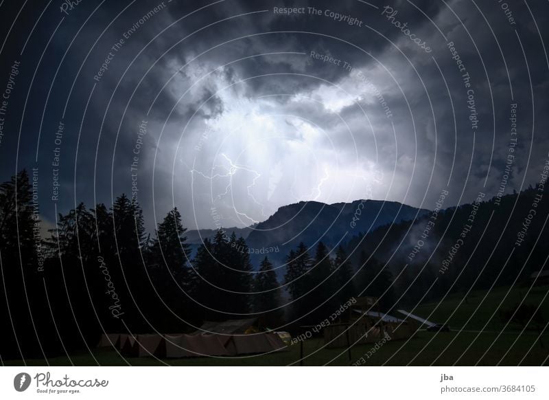 Thunderstorm over the camp Thunder and lightning lightning bolt cloud Night Bright conceit campsite Forest Mountain ridge impressive Storm night