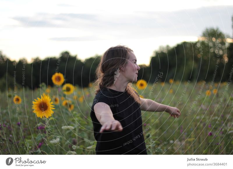 Turn me always circle sunflower field in midsummer Woman brunette long hairs Black T-shirt Sunflower field Rotate Dance Edge of the forest Field Flower meadow