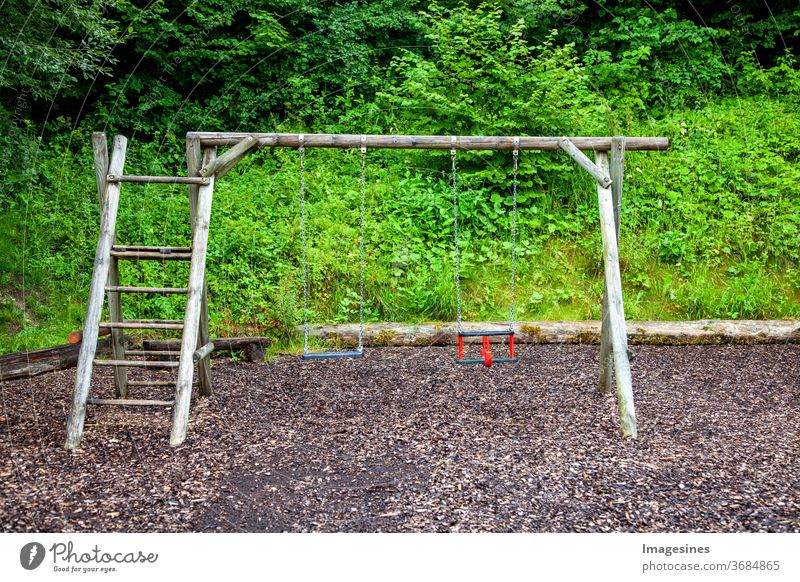 Empty chain swing on playground children's playground covid-19 pandemic Virus Playing Playground Park Nostalgia forsake sb./sth. silent coronavirus lockdown