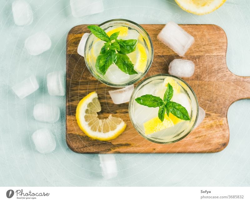 Fresh lemon lemonade in jug and glasses summer drink beverage top view cocktail mint food flat lay juice vintage fruit leaf spring citrus gin vodka infused