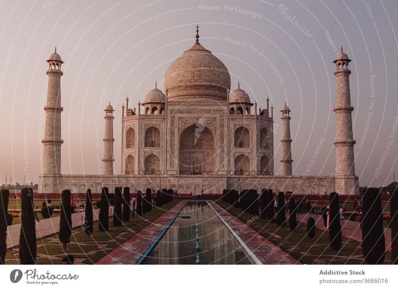 Famous Taj Mahal mausoleum against sunset sky taj mahal india building architecture agra landmark evening famous ancient religion skyline old exterior minaret