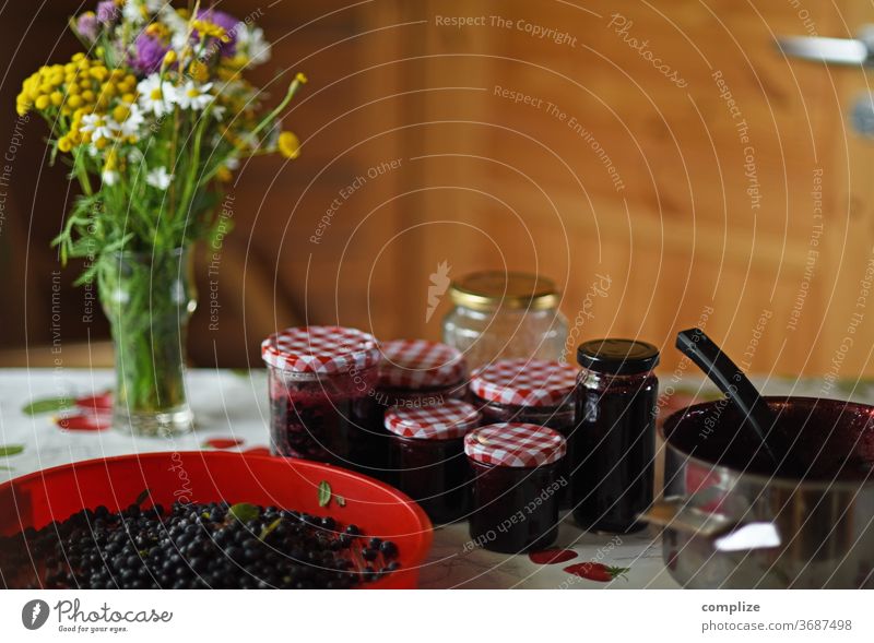 Make blueberry jam Blueberry jam Jam boil make jam boil down Jam jar Glass Wooden hut Table saucepan