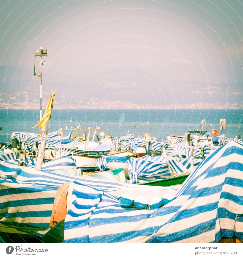 Boats covered with blue and white tarpaulins To hibernate spring Ocean Horizon Exterior shot Nature Deserted Sky Landscape Blue Beautiful weather Copy Space top