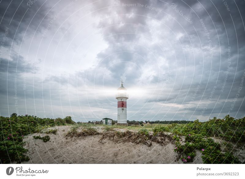 Lighthouse in cloudy weather storm stormy cloudscape north beautiful old nautical outdoors sunset coastal cloudy sky seascape famous horizon sunlight stone