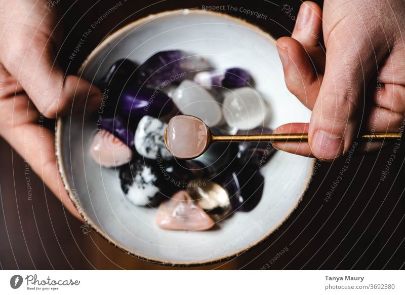 Bowl full of colorful gemstones with a golden spoon holistic holistic food Esotericism gemology Treasure Colour photo Violet Pink Food photograph Nutrition