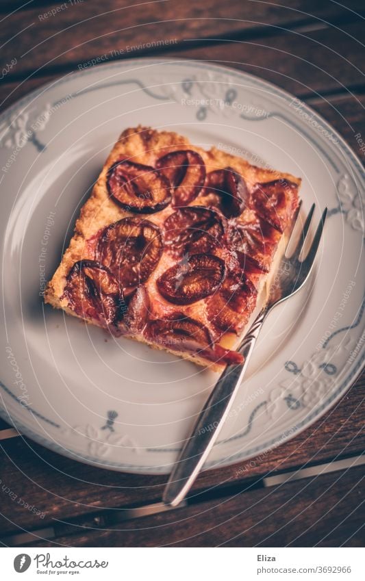 A piece of plum-dachi on a plate at grandma's plum dachshis plum cake Cake Delicious Table squiggled vintage Old fashioned Baked goods homemade Plums