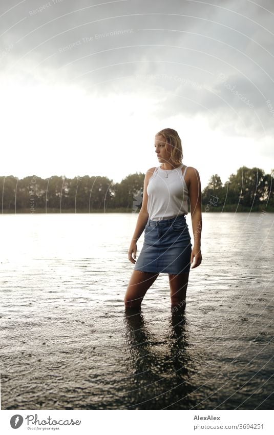 Portrait of a young woman in a lake Young woman Woman Blonde smile portrait Jewellery already Long-haired Landscape tanned Self-confident Summer natural