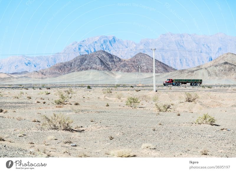 in iran   mountain landscape rock desert nature persia travel sky asia stone scenic hill valley tourism view road panorama green transport scenery beautiful