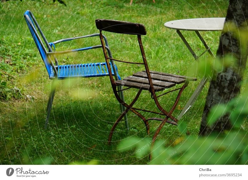 Sitting area in the garden with old, cobbled garden furniture Garden Outdoor furniture Seating Table Chair vintage Old Cozy hygge wabisabi Coffee table