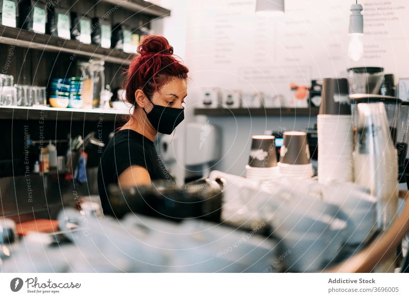 Female barista preparing coffee in cafe prepare woman mask coronavirus coffeemaker counter delicious female machine protect prevent medical bartender service