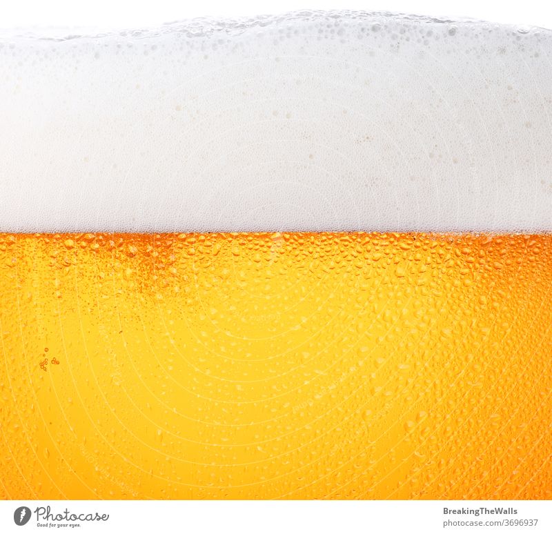 Close up background of beer with bubbles in glass Beer froth closeup pouring frosty fresh lager drops ale side view low angle texture mug large big white orange