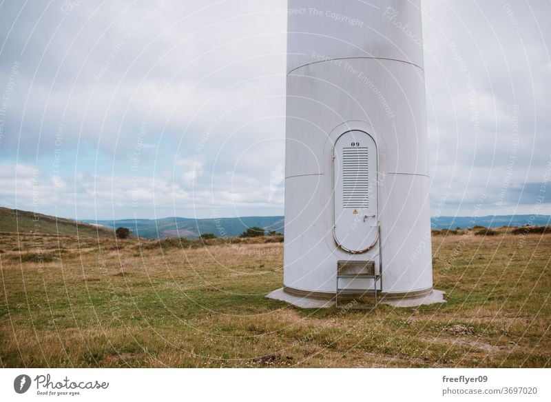 Maintenance entrance of a wind turbine door maintenance eco energy electricity ecology copy space sky galicia spain clean farm turbines alternative generator