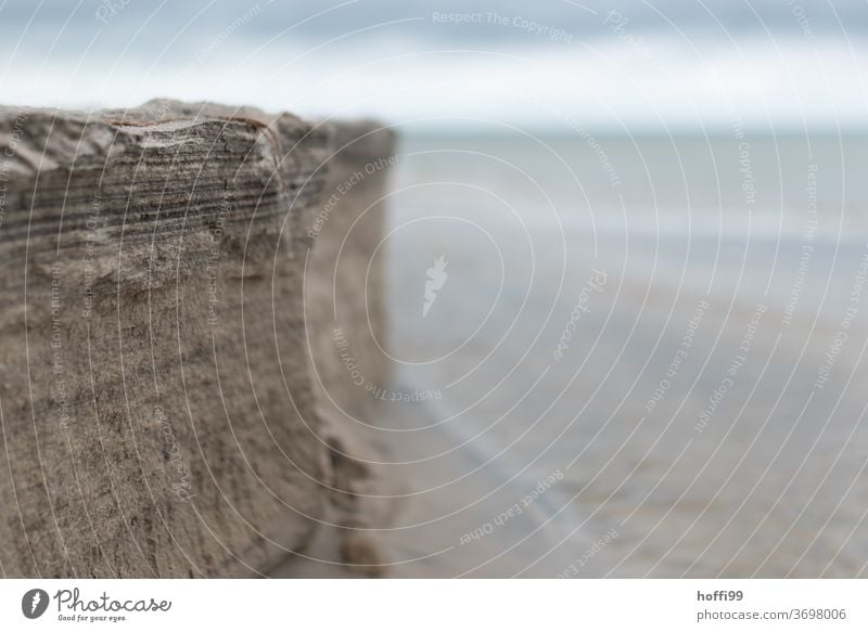 the edge of the beach rises to the cliffs Beach Tear-off edge steep coast coastline ebb and flow Low tide High tide Abstract Sand Coast Ocean Water Tide