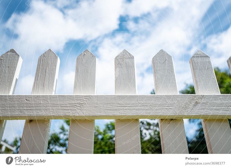 White picket fence under a blue sky plank fencing imagination grass garden separate daydream happy house future private beauty perfect painted concept rural