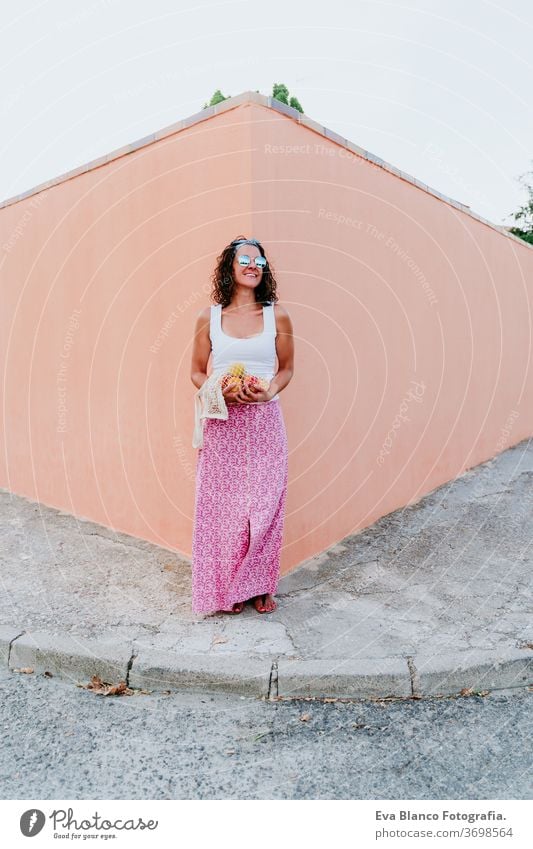 woman holding cotton bag with fruit. Eco friendly, zero waste concept caucasian city urban consumer green environment buy money pursed reduce net vegetarian