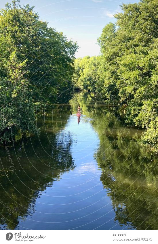 Stand Up Paddling on the river River huts Blue green boat Rowing Summer fun Joy Couple Landscape reflection at home vacation Water Surface of water Sky Nature