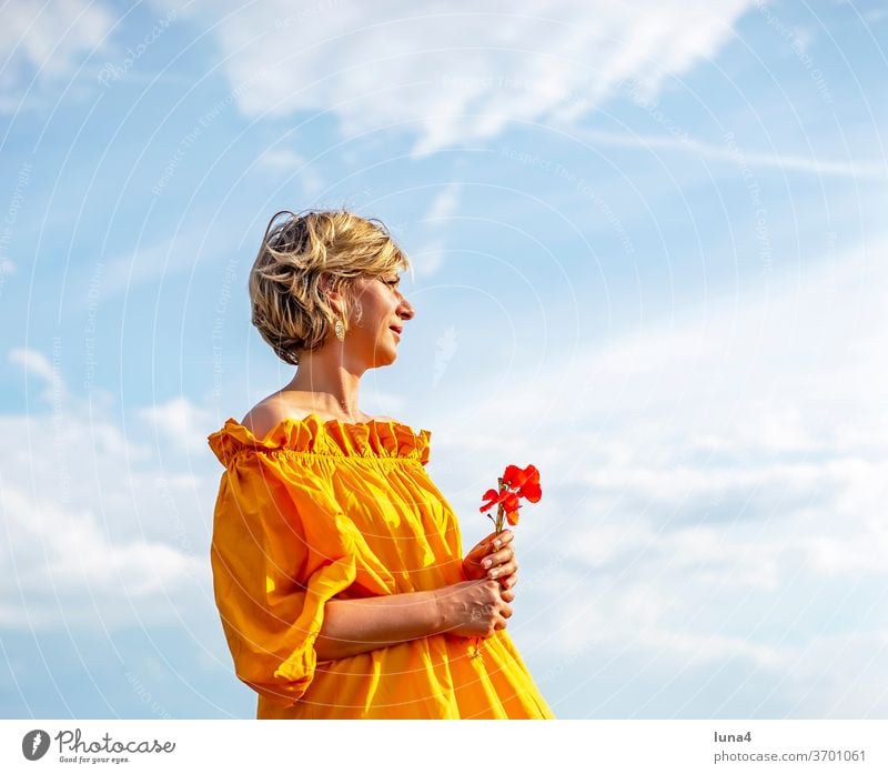 Woman with poppies Poppy Bouquet flowers Sun To enjoy sunbathe stop smile Laughter Young woman sensual daintily papaver fortunate cheerful time-out luck Joy