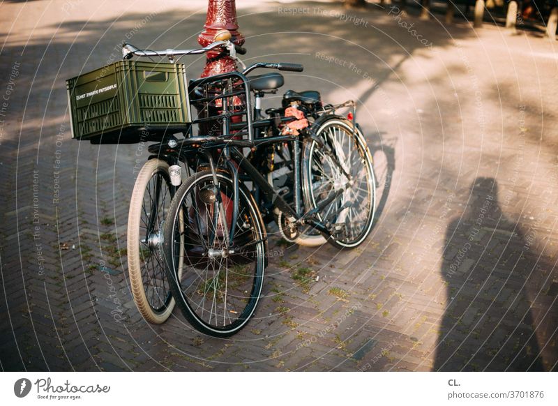 Two bicycles Bicycle Mobility Parking Lanes & trails bicycle basket Means of transport Transport Road traffic Cycling Traffic infrastructure Cycle path