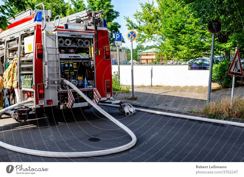 Berlin, 08.06.2018 a fire engine with a lot of equipment Fire engine hose firefighting equipment fire fighting equipment respirator fire safety fireproof sky