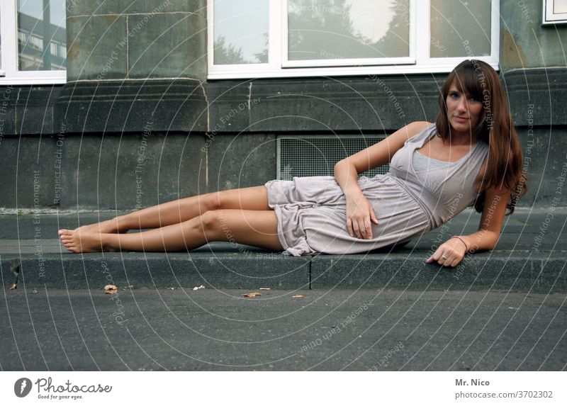 very relaxed waiting Lie Street Sidewalk Curbside Barefoot Dress Long-haired Wait House (Residential Structure) Window built Loneliness Easygoing Posture