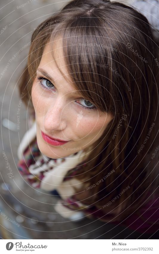 Young woman looks up at the camera Upward Bird's-eye view Exterior shot Looking Looking into the camera look up Face Hair and hairstyles Long-haired luck