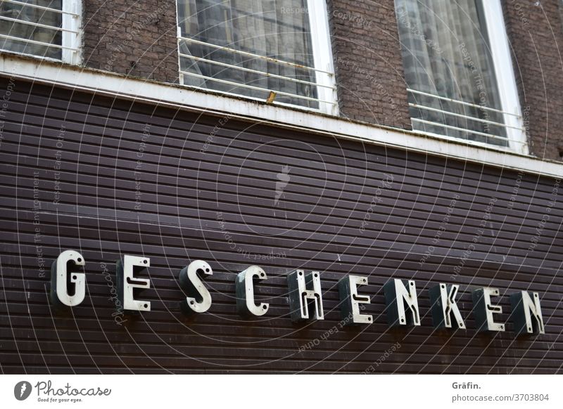 Writing on a house in a small Dutch town where the neon lights have seen better times lettering Neon light Characters Letters (alphabet)