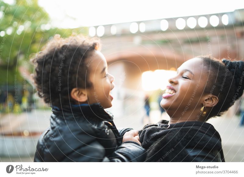 African american mother with his son. single mother monoparental park happy boy people black family smiling child together 20s woman fun love women person