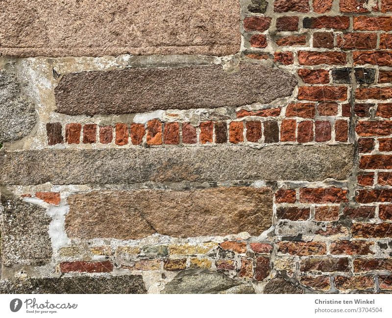 Very old facade with a mix of different stones, sandstones and bricks Wall (barrier) Facade Old Ancient Clinker bricks Bricks Red Beige Reddish Wall (building)