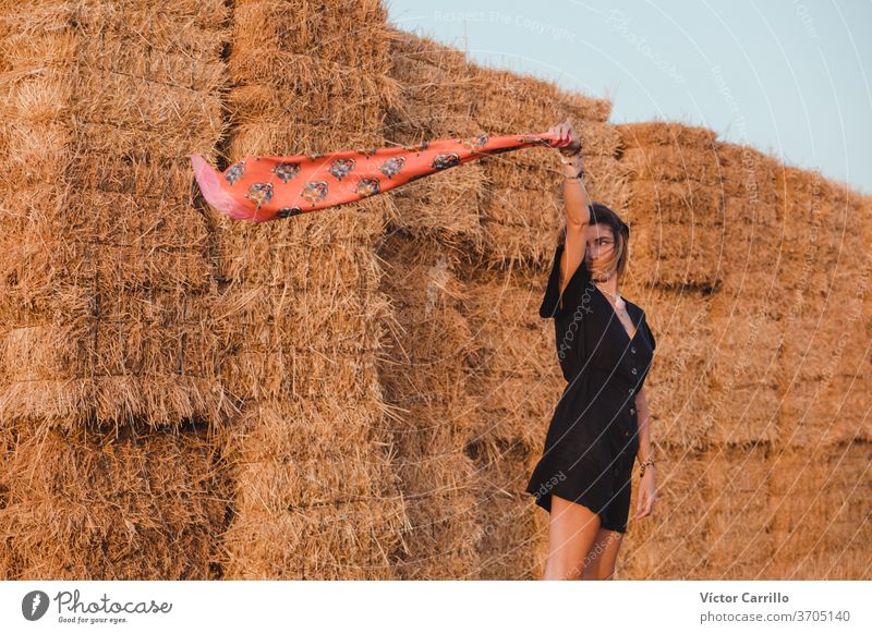 Young woman in dress in a solitary field in the countryside landscape freedom woman water adult alive yoga air arm close up alternative portrait breathe